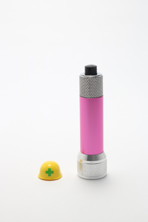 Helmet and Flashlight on white background.の写真素材