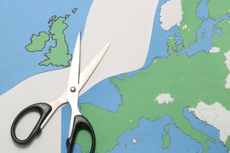 United Kingdom leaves the European Union. Scissors cut the United Kingdom from EU. Brexit UK EU referendum concept.の写真素材