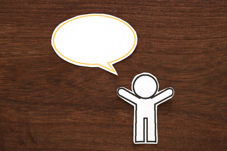 Paper person with colorful blank dialog speech bubble. Communication concept.の写真素材
