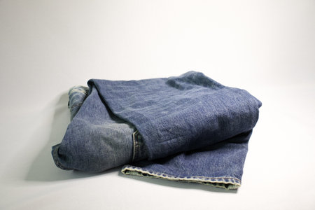 Photo blue bright jeans on a white backgroundの写真素材
