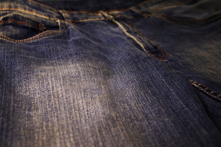 Photo image of bright blue beautiful new jeans closeupの写真素材