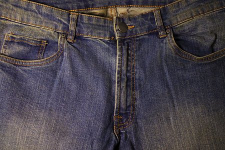 Photo image of bright blue beautiful new jeans closeupの写真素材