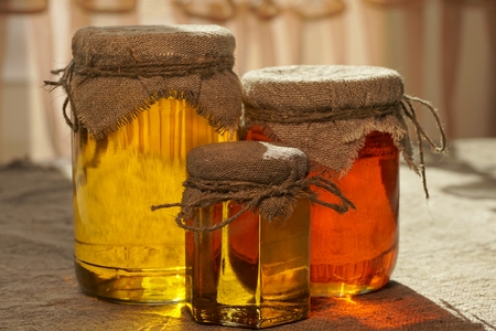 Jars of honey. Different types of honey. Honey jar. Natural raw honeyの写真素材