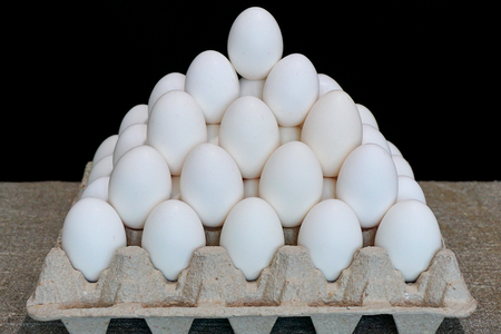White chicken eggs. Pyramid from chicken eggsの写真素材