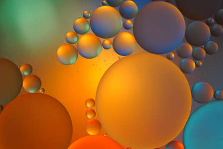 Oil drops on a water surface abstract backgroundの写真素材