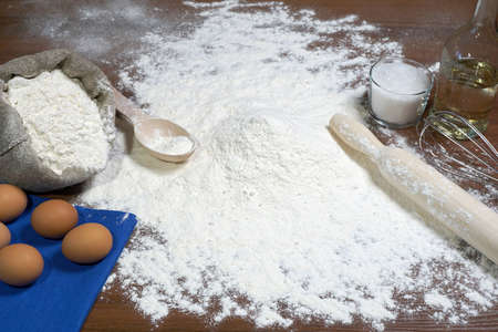 Ingredients for baking bakery products. Flour and eggs, flour rolling pinの写真素材