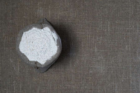 Flour in a bag on a background of linen fabric. Top viewの写真素材