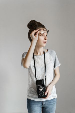 Girl-photographer in search of musicの写真素材