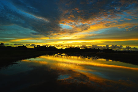 Beautiful sunset over the river with reflection in water, Taiwan
