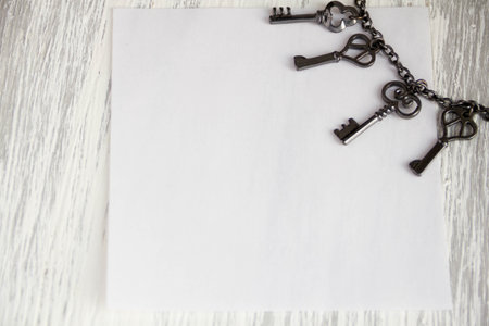 key on wood grey background Sticky note