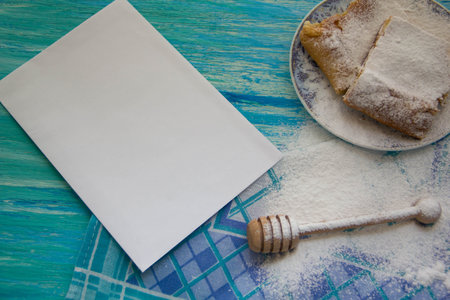 Styled photography for blog posts.Cakes sprinkle with powdered sugar, jam herbal tea on a wooden table. Top view mockupの写真素材