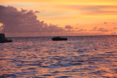 sunset on the beach of caribbean seaの写真素材