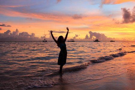 the female silhouette on the background of sea sunset, relaxation,