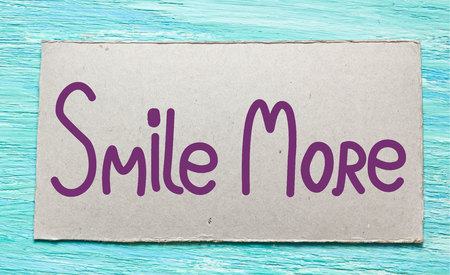 Smile more. Inspirational quote handwritten ink and brushの写真素材