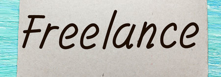 freelance Inspirational quote women's hand lettering for posters writing notebook note turquoise wooden background Word refer news, current affairs, special occasions business planningの写真素材