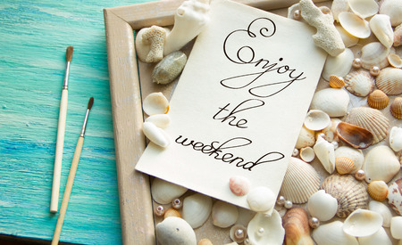 Events Inspirational quote Enjot the weekend lettering on turquoise wooden backgroundの写真素材