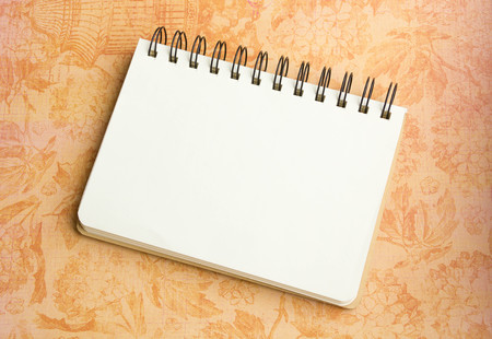 Open notebook on desk, on wooden table, can be used for your text or artwork, Top view business conceptの写真素材