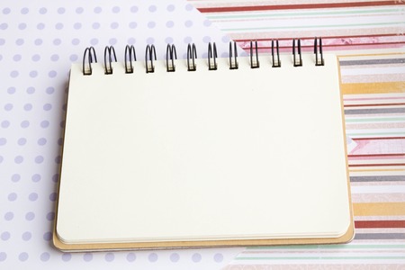 Open notebook on desk, on wooden table, can be used for your text or artwork, Top view business conceptの写真素材