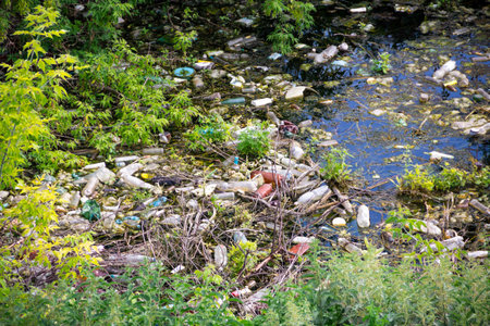 Illegal bulk waste discarded. Landfill in the river. polluted environment. Environment problem