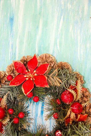 Christmas border from christmas wreath useful as christmas decoration. Christmas Greeting Card. Vintage Style. Hanging christmas decoration on wooden background.の写真素材