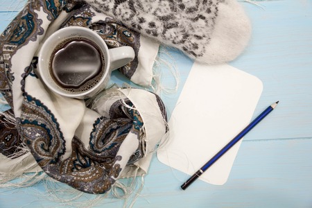 Cosy soft winter background, knitted sweater Cup hot coffee old vintage wooden board. Christmas holidays at home. place for text, Top view flat lay with copy space for slogan or text messageの写真素材