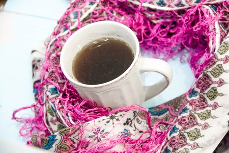Cosy soft winter background, knitted sweater Cup hot coffee old vintage wooden board. Christmas holidays at home. place for text, Top view flat lay with copy space for slogan or text messageの写真素材