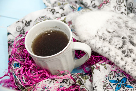 Cosy soft winter background, knitted sweater Cup hot coffee old vintage wooden board. Christmas holidays at home. place for text, Top view flat lay with copy space for slogan or text messageの写真素材