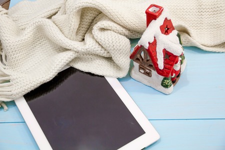 Cosy soft winter background, knitted sweater tablet Cup hot coffee old vintage wooden board. Christmas holidays at home. place text, Top view, flat lay with copy space for slogan or text messageの写真素材