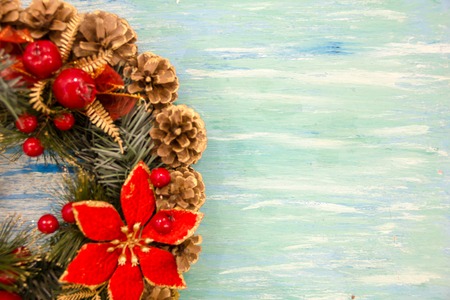 Christmas border from christmas wreath useful as christmas decoration. Christmas Greeting Card. Vintage Style. Hanging christmas decoration on wooden background.の写真素材