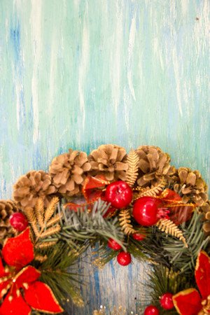 Christmas border from christmas wreath useful as christmas decoration. Christmas Greeting Card. Vintage Style. Hanging christmas decoration on wooden background.の写真素材