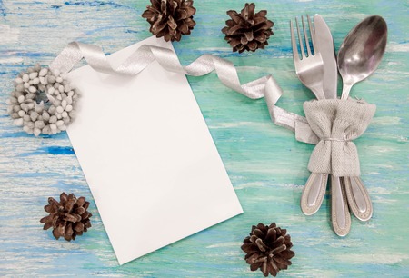 Christmas dinner table setting background with rustic decorations. View from above. with christmas pine branches,ribbon and bow. Holidays backgroundの写真素材