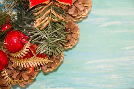 Christmas border from christmas wreath useful as christmas decoration. Christmas Greeting Card. Vintage Style. Hanging christmas decoration on wooden background.の写真素材