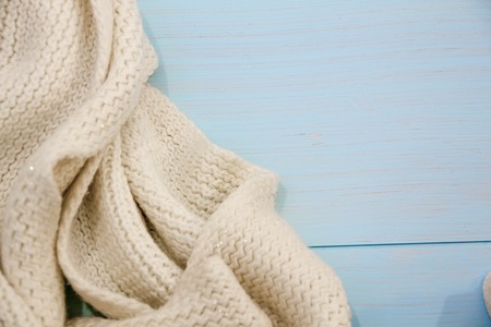 Cosy soft winter background, knitted sweater Cup hot coffee old vintage wooden board. Christmas holidays at home. place for text, Top view flat lay with copy space for slogan or text messageの写真素材