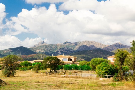 SAN TEODORO Traditional holiday villa houses on beach, Sardinia island, Italyの写真素材