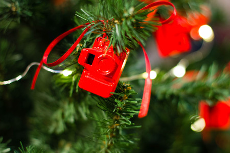 Christmas tree decorated with small figures red photo camerasの写真素材