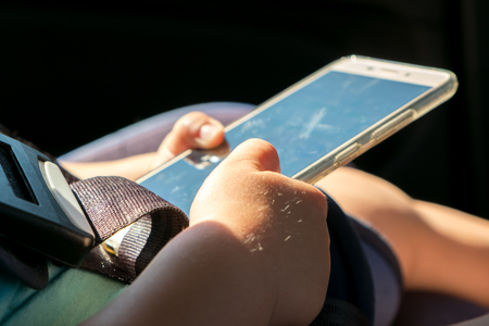 Child using mobile smart phone. Close up.の写真素材