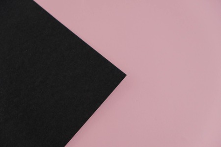 pink torn paper element over black background.の写真素材