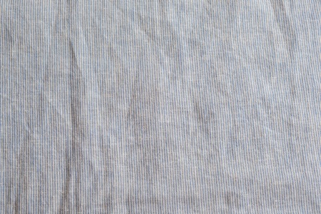 Grey heather texture. Grey fabric texture. Background with delicate striped pattern. Real heather grey knitted fabric made of synthetic fibres textured backgroundの写真素材