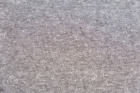 Grey heather texture. Grey fabric texture. Background with delicate striped pattern. Real heather grey knitted fabric made of synthetic fibres textured background.の写真素材