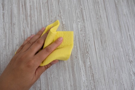 Housemaid cleaning a bathroom, closeup shot.の写真素材