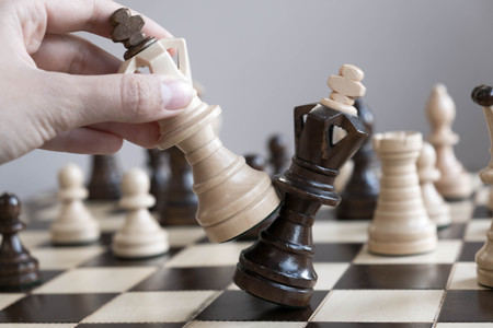 Black and White King and Knight of chess setup on dark background . Leader and teamwork concept for success. Chess concept save the king and save the strategyの写真素材