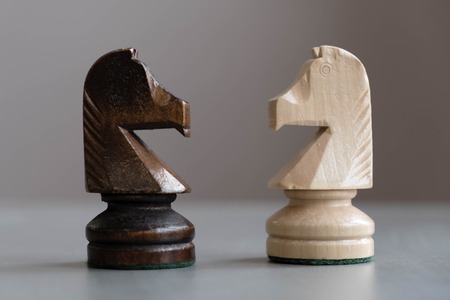 International Day of Chess, figures. Chess photographed on a chessboard. Chess is an strategy and intelligence board game originated in India that is played between two people on a chessboard.の写真素材