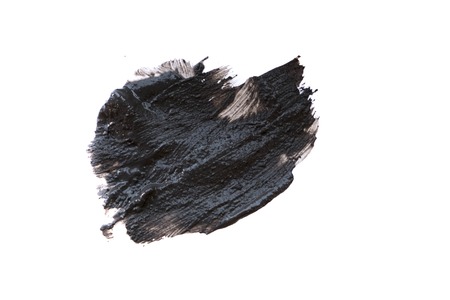 Black volcanic cosmetic clay texture close up. solution of cosmetic clay abstract background.の写真素材