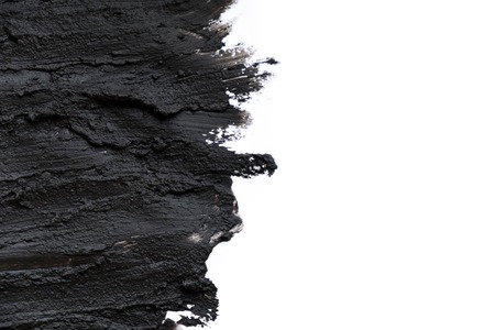 Black volcanic cosmetic clay texture close up. solution of cosmetic clay abstract background.の写真素材