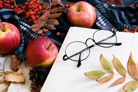 Top view of Coffee cup and paper notebook on wooden table background,copy space in concept color of autumn.の写真素材
