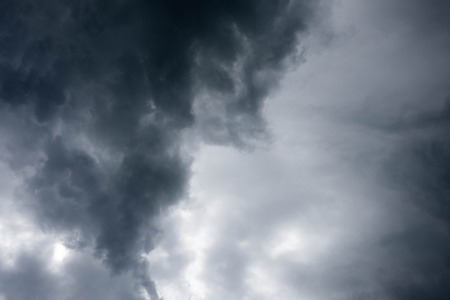 dark storm clouds before rain. Dramatic sky with stormy cloudsの写真素材