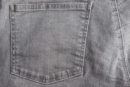 Jeans texture with pocket. Highly detailed closeup of gray denim pocketの写真素材