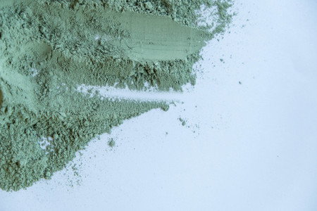 Pile of blue cosmetic clay isolated on white backgroundの写真素材