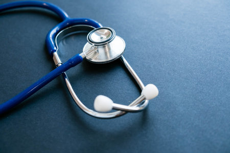 Stethoscope reflection on black background. Close up on a black background. Top view, flat lay. copy space for text.の写真素材