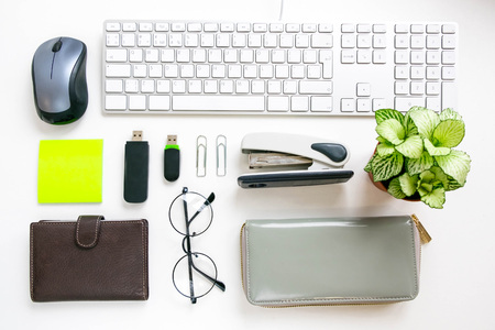 Flat lay, top view office table desk frame. feminine desk workspace with laptop, diary, succulent, glasses, watch on white background.の写真素材